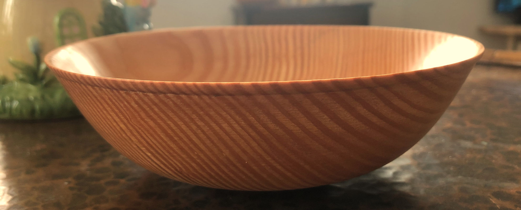 Woodturning on a lathe – turned wooden object